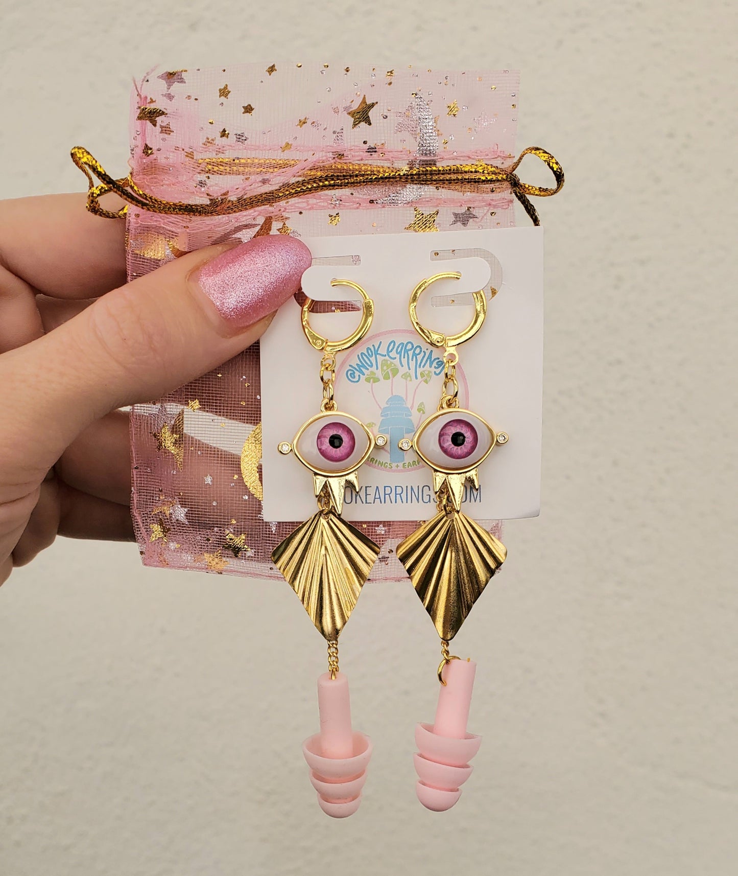Burning man eye earrings