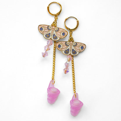 pink high fidelity earplug earrings with whimsical moth charms cottage core